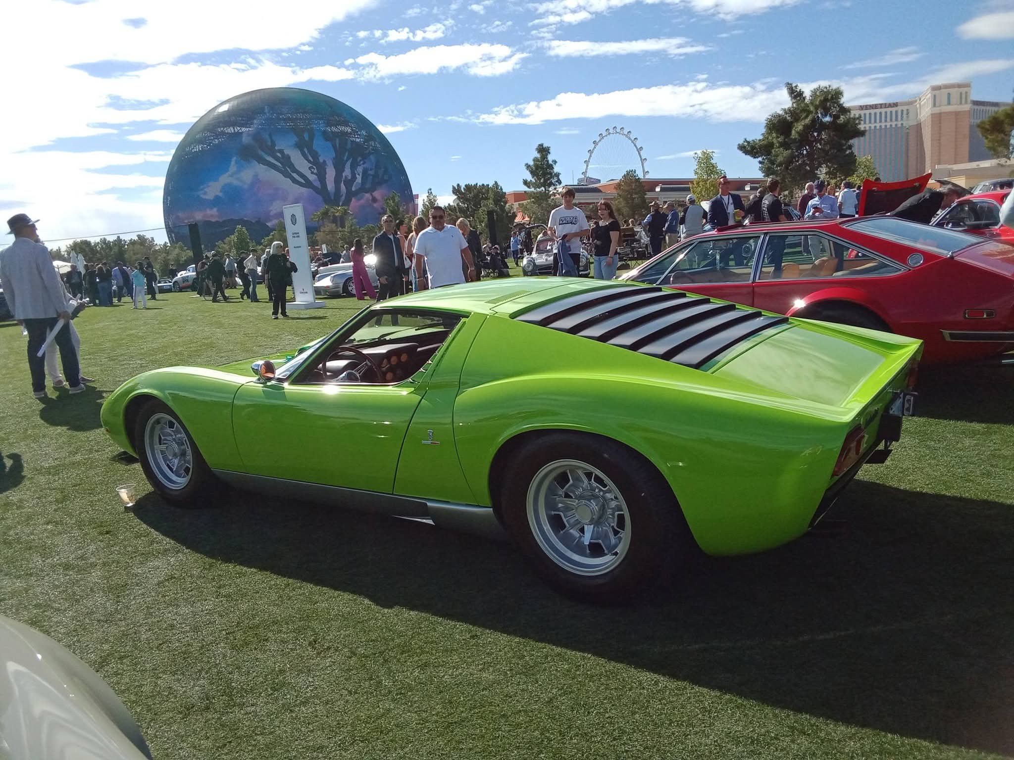 Green Lamborghini at an outdoor car show