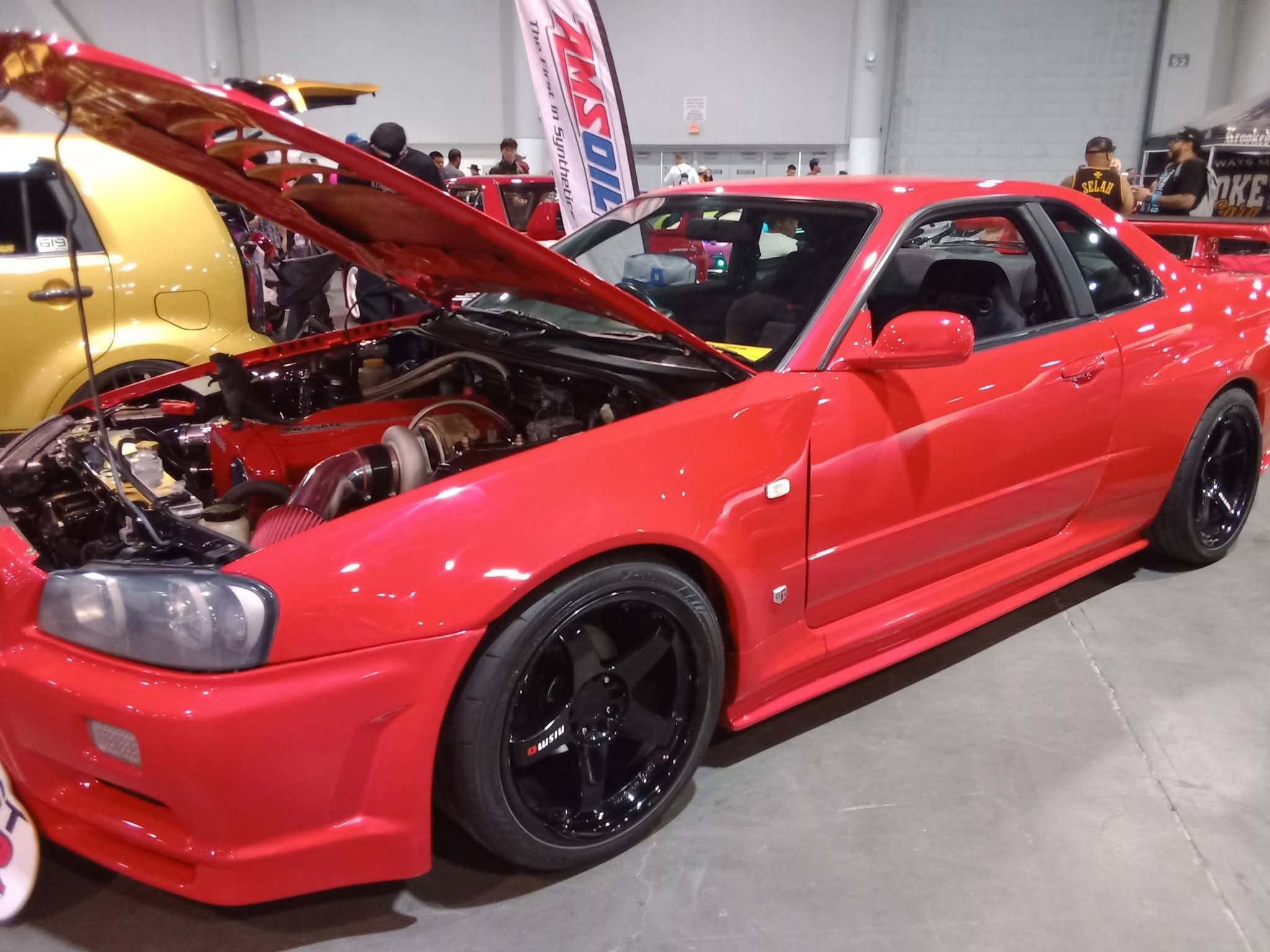 Red Nissan Skyline at a car show
